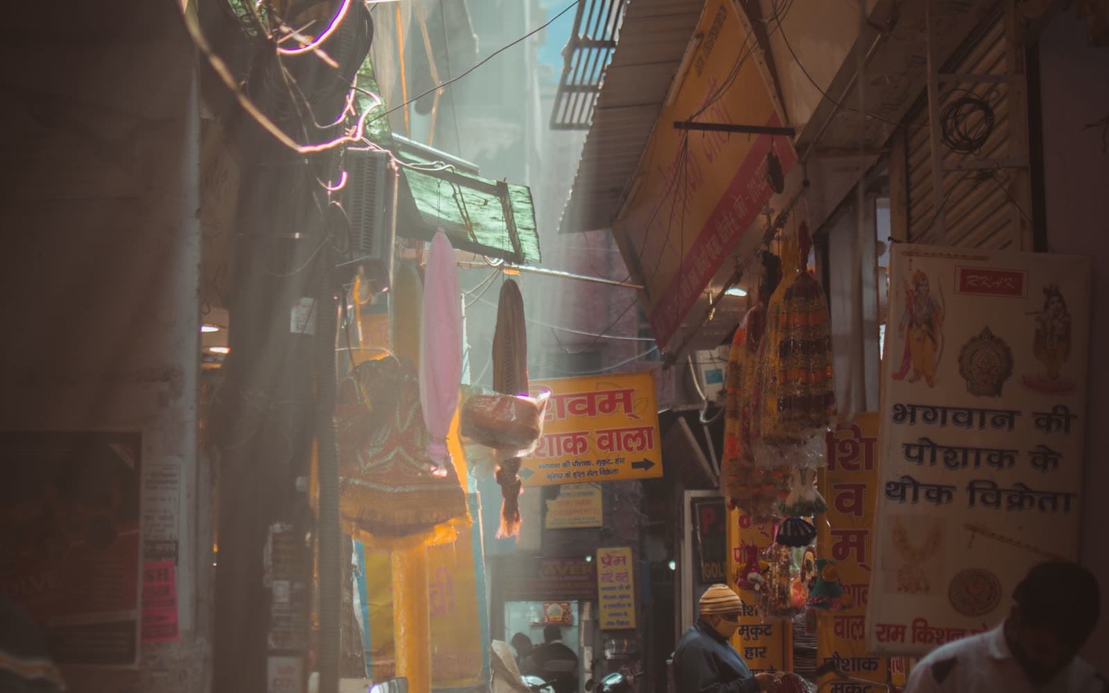 A narrow market lane in New Delhi, with shops on both sides